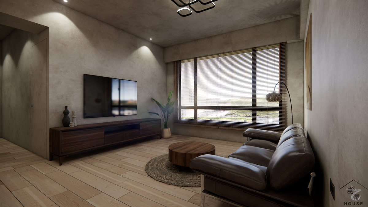 侘寂風客廳電視牆區域的特寫圖，牆面使用微水泥特殊塗料，營造出粗獷自然的質感，電視下方配置一座深胡桃木色的低矮電視櫃，線條極簡，提供了充足的收納空間；落地窗配有木百葉窗簾，將柔和的自然光引入室內，右側深棕色皮革沙發，搭配編織地毯和圓形木茶几，整體空間簡潔、大器，充滿禪意與寧靜。